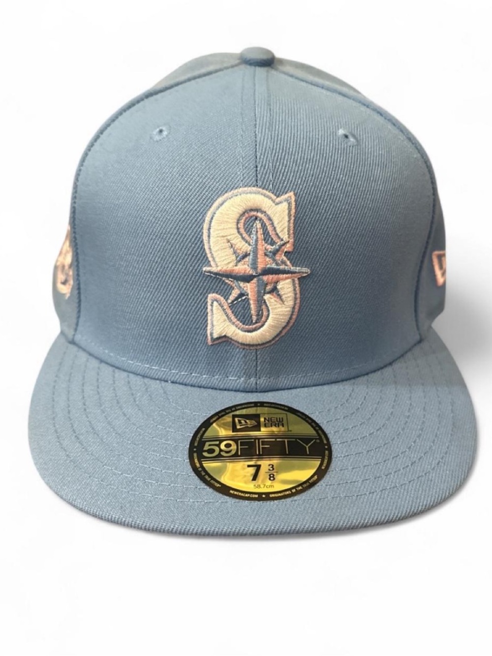 New Era Fitted Cap in Light Blue with Cream Logo